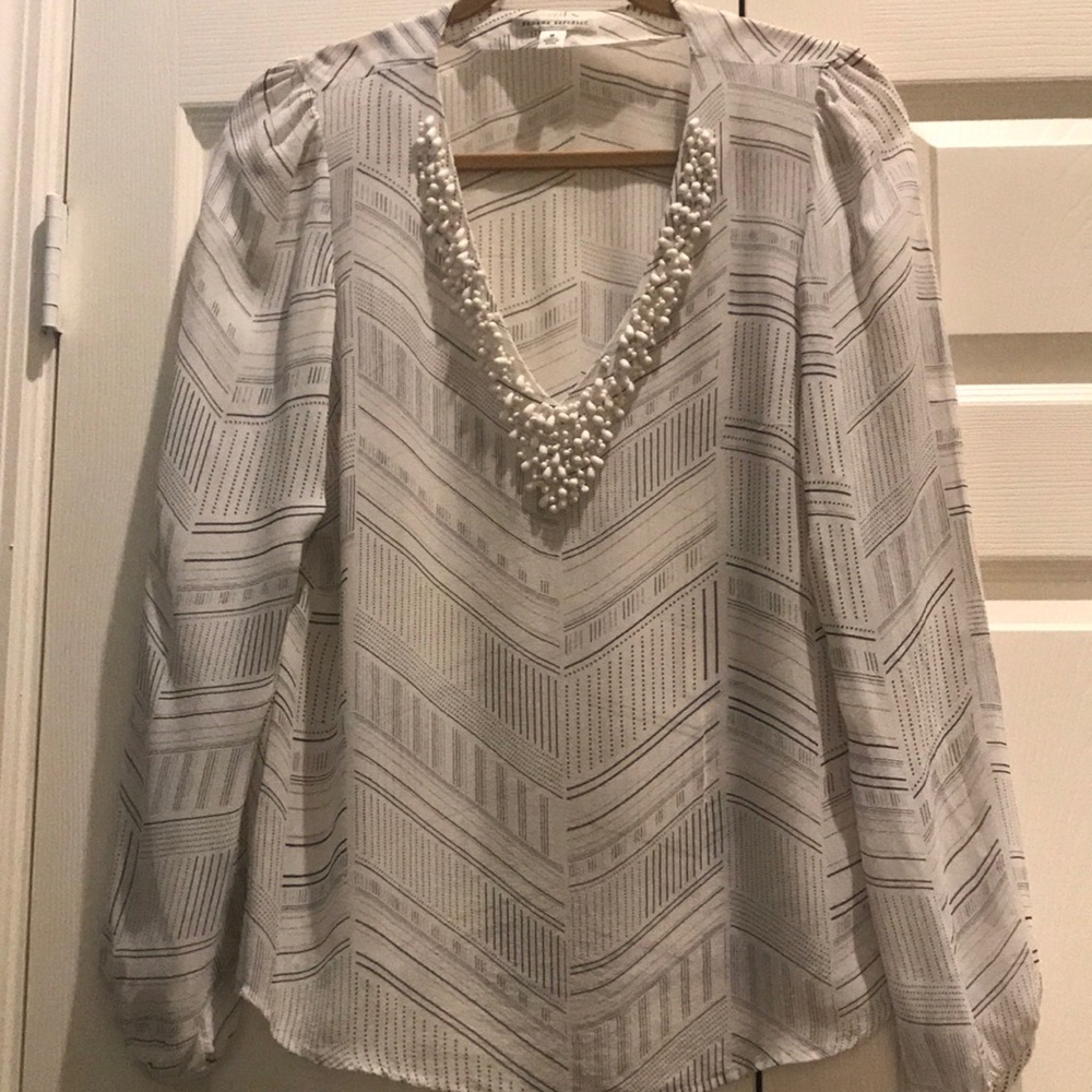 Blue and White embellished sheer shirt.